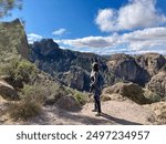 Solitary hiker looks out over beautiful landscape of Pinnacles National Park