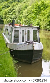 A solitary narrow boat moored up at Crooke Village on the Leeds Liverpool Canal, Standish Lower Ground, Wigan, Lancashire, United Kingdom
