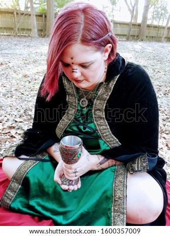 A solitary pagan worshiper performs ceremony