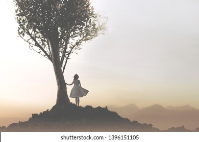 solitary woman under a tree looking at a mystical and suggestive landscape