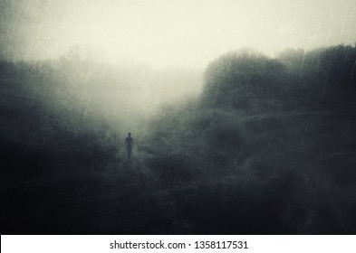 Solitude Concept, Man Walking Alone And Contemplating In Rain, Dark 
Surreal Landscape