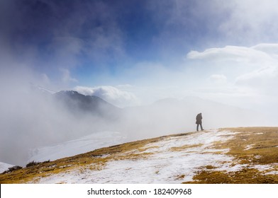 Solitude. Man walking on the mountain