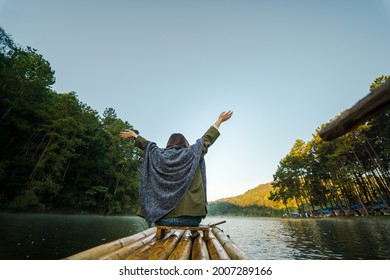 Solo Asian Woman Travel By Thai Local Bamboo Boat In Tropical Forest And Lake In Autumn Season