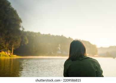 Solo Asian Woman Travel By Thai Local Bamboo Boat In Tropical Forest And Lake In Autumn Season