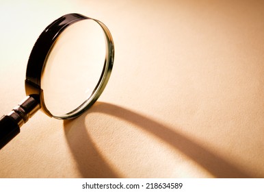 Solo Close Up Magnifying Glass On Light Brown Platform