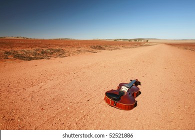 Solo Fiddle, Lying On The Outback Of Western Australia.