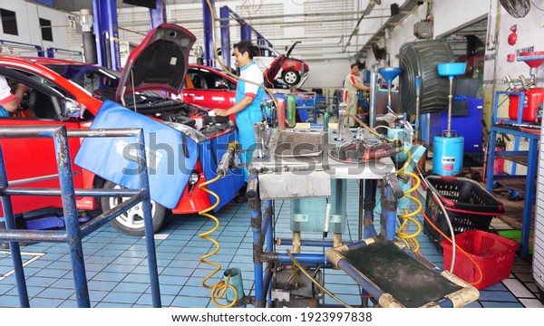 SOLO - INDONESIA, Feb 21, 2021 : Maintenance car in
service center via insurance system at garage service with not
focus image 
