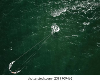 Solo kite surfer from above off the Dorset coastline