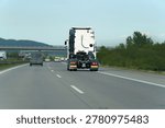 Solo lorry cab on empty highway