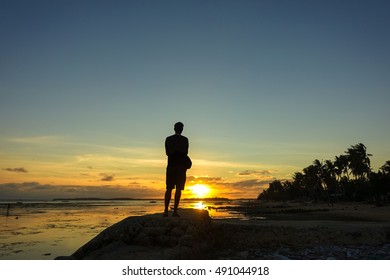 Solo Traveler Gazing At The Sunset