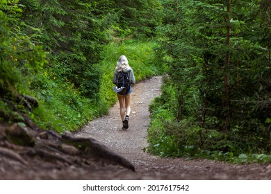 Solo Traveling Young Female Hiking In The Woods, Blonde Female Exploring The Forest