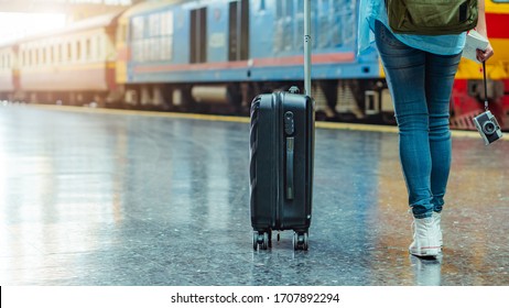 Solo Woman Backpacker Traveler Plan Safety Trip Low Cost Budget Summer Holiday After Coronavirus. Empty Tourist On Train Railway Platform. Use Bus Train Sustainable Environmental Friendly Transport