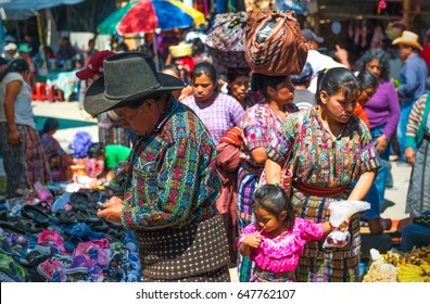 SOLOLA, GUATEMALA - MARCH 22, 2013: Buyers and sellers on the local market of Solola near Panajachel and the Atitlan Lake with people wearing colorful mayan textiles and clothing.