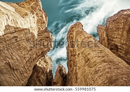 The Solomons Pillars  with blue cloudy sky viewed from below in Timna Park near to Eilat, Israel. (HDR image)