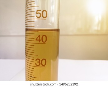 The solution in the measuring cylinder is read by 45 milliliters. Reading scientific instruments. Laboratory measurements.