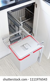 A Solution For Storing The Trash Can In The Kitchen Cupboard Under The Sink. Corner Unit With A Pull-out Shelf For The Trash Can.