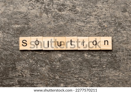 solution word written on wood block. solution text on table, concept.
