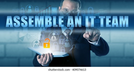 IT Solutions Provider Pressing ASSEMBLE AN IT TEAM On A Virtual Visual Display. Business Challenge Metaphor And Information Technology Concept Building An IT Team As Part Of A Disaster Recovery Plan.