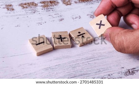 Solving Mathematical Problems: Hand Placing Addition Symbol Tile with Basic Operations