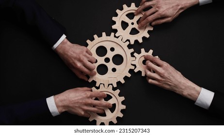 solving the problem concept - puzzles and cogwheels. - Shutterstock ID 2315207343