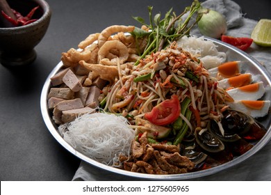 Som tum or papaya salad  on dark table background. Thai food concept - Powered by Shutterstock