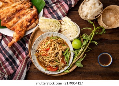 Som Tum Thai - Papaya Salad with Grilled chicken Thai Food Style Concept. Top View  - Powered by Shutterstock