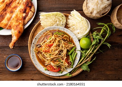 Som Tum Thai - Papaya Salad with Grilled chicken Thai Food Style Concept. Top View 