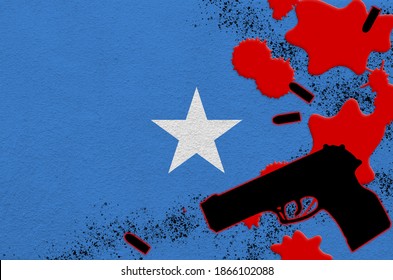 Somalia Flag And Black Firearm In Red Blood. Concept For Terror Attack Or Military Operations With Lethal Outcome. Dangerous Handgun Usage