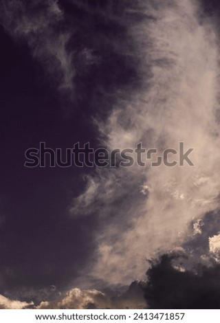 Somber and dark cloudscape for background use