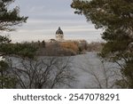 Somber late autumn view through trees Saskatchewan Legislature building 