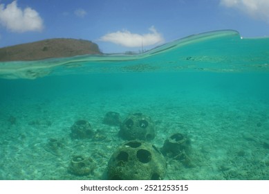 some artificial reef balls on a beach on the island of Curacao                               