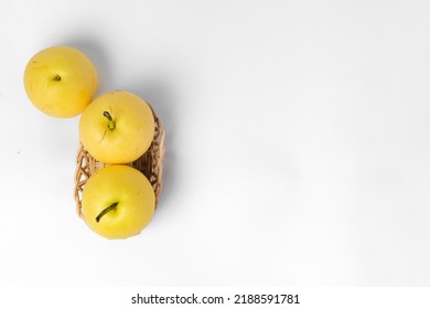 Some asian pears in a basket on a white background, copy space - Shutterstock ID 2188591781