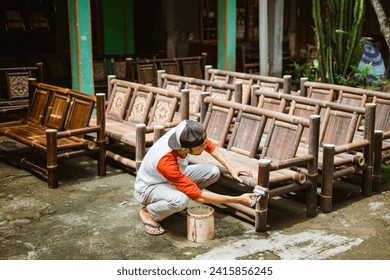 some bamboo chair crafts are finished by bamboo chair craftsmen outside the home - Powered by Shutterstock