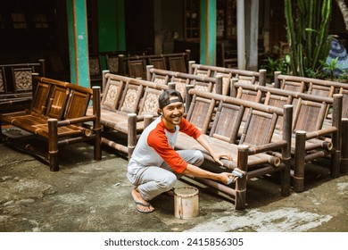 some bamboo chair crafts are polished by craftsmen who work outside the home - Powered by Shutterstock