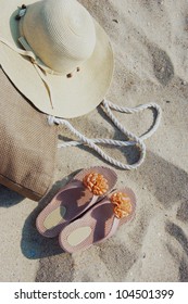 Some Beach Items Lying On Sand