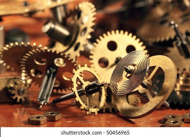 Some brass gears and a pendulum from old hours - Powered by Shutterstock