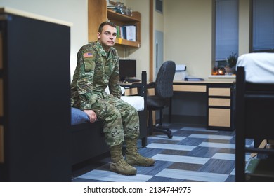 Some Call It A Dorm, I Call It Home. Shot Of A Young Soldier Sitting On His Bed In The Dorms Of A Military Academy.