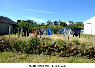 Some clothes drying on a string outside.