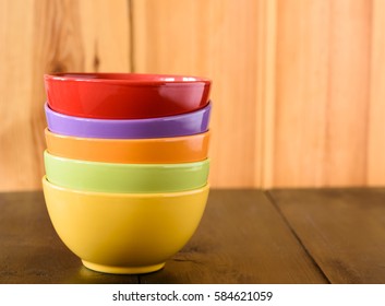 some colored bowls on a wooden table - Powered by Shutterstock