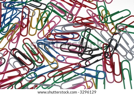 Similar – Colorful paper clips on a black board surface