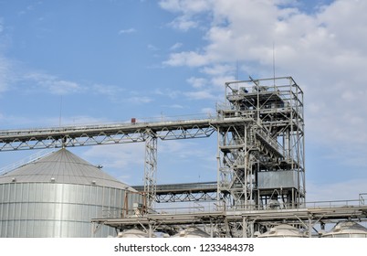 Some Equipment Of Modern Sugar Factory, Metal Structures, Tower And Top Of A Big Vat (tank), Blue Sky With White Clouds, Panoramic Image