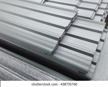 Some focus of water on metal sheet roof, Reflect light on metal sheet roof, Silver color Metal Sheet roof