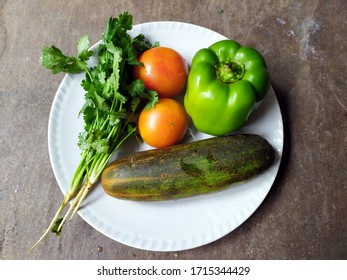 some fresh healthy vegetable put in a white plate