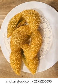 Some Fried Sticky Rice Balls On A Plate