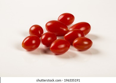 Some grape tomatoes in a white background