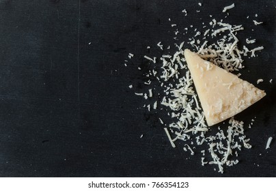 Some grated cheese is on wooden background  - Powered by Shutterstock