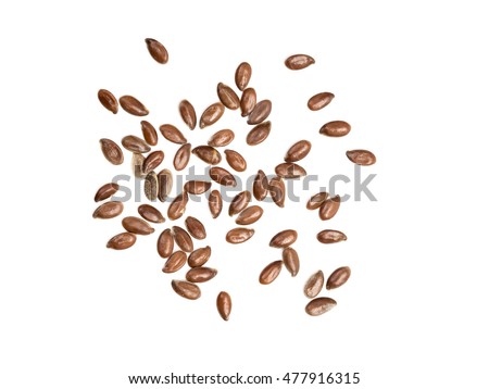 Some linseeds spread out on white background seen from above