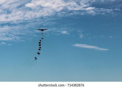 Some Military Paratrooper Drop From A Airplane