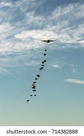 Some Military Paratrooper Drop From A Airplane