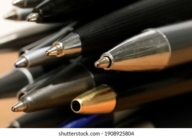Some miscellaneous used ball pens in a pile. Office accessories. - Shutterstock ID 1908925804